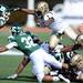 Eastern Michigan sophomore Javonti Greene and Western Michigan senior Doug Wiggins reach for a loose ball during the first quarter against Western Michigan at Rynearson Stadium on Saturday afternoon. Melanie Maxwell I AnnArbor.com